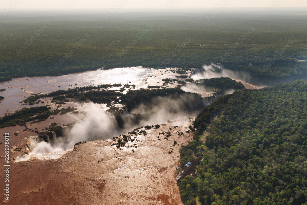 Top view of the Iguazu waterfalls, parana river and huge rainforest spaces.