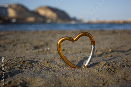 heart on sand by the sea