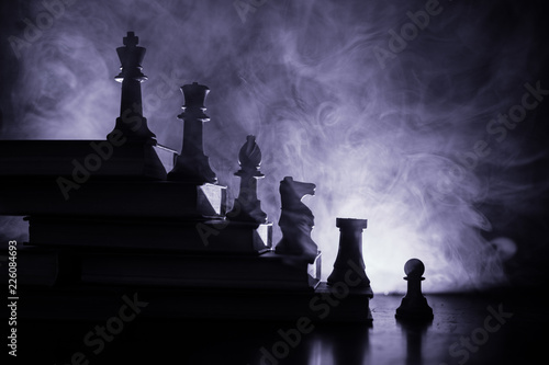 Business hierarchy. Strategy concept with chess pieces. Chess standing on a pyramid of wooden building blocks with the king at the top. copy space.