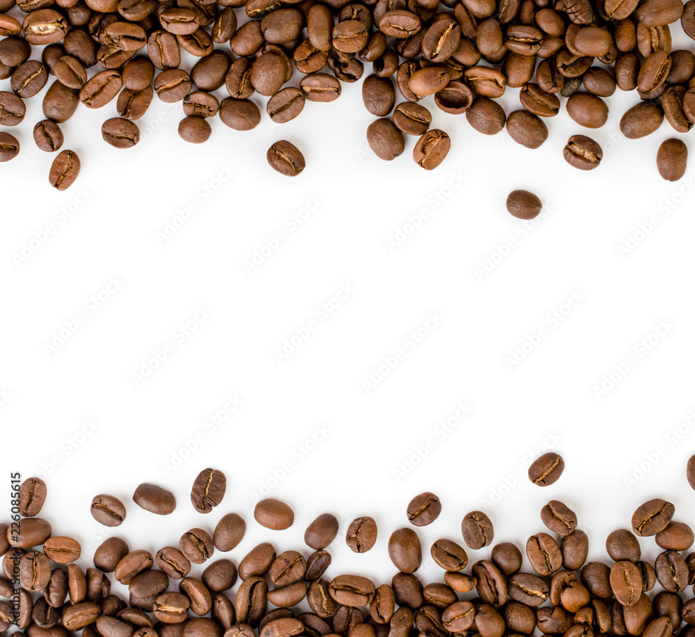 Coffee beans are laid out on top and bottom of the frame on a white ...