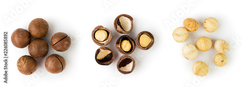 Three piles of macadamia nuts in a shell, broken and peeled on a white. The view from the top.