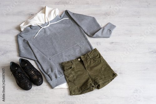 Teen clothing set: grey sweatshirt, green shorts and boots in military style