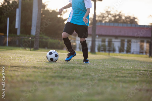 Soccer players practicing on a field.