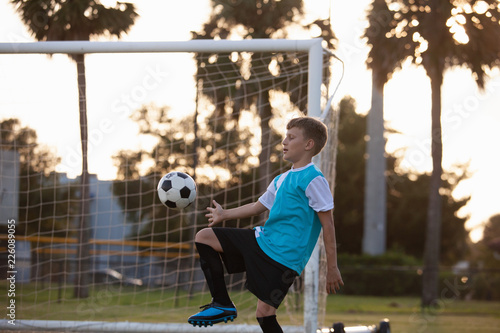 Soccer players practicing on a field.