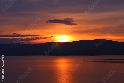 Beautiful evening sunset on the lake. Landscape. Background.