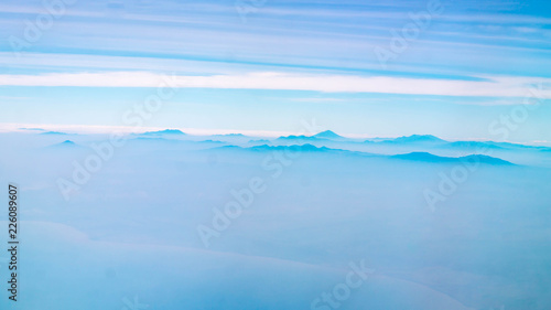 mountains among the cloud. panorama of mountain peaks covered by cloud. nature background