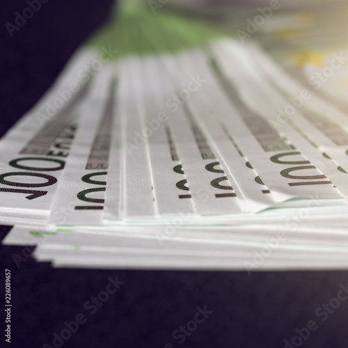 European euro currency bank notes lying on a desk close-up, symbolizing finance and business..