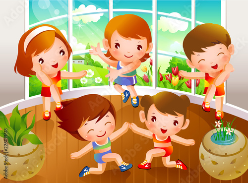 High angle view of two boys and three girls dancing