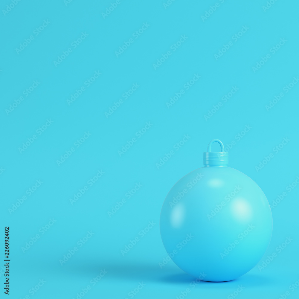 Christmas ball on bright blue background in pastel colors Christmas ball on bright blue background in pastel colors