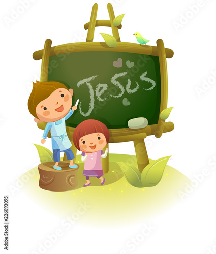 Boy writing Jesus on a blackboard