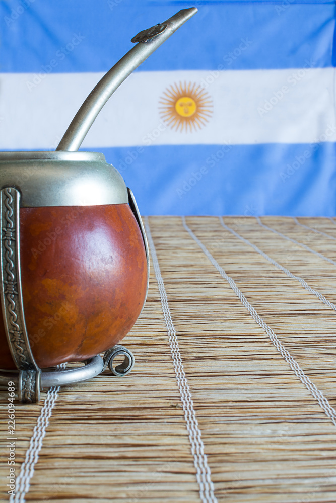 mate, mate grass (yerba mate) with flag of Argentina in the background  Stock Photo | Adobe Stock