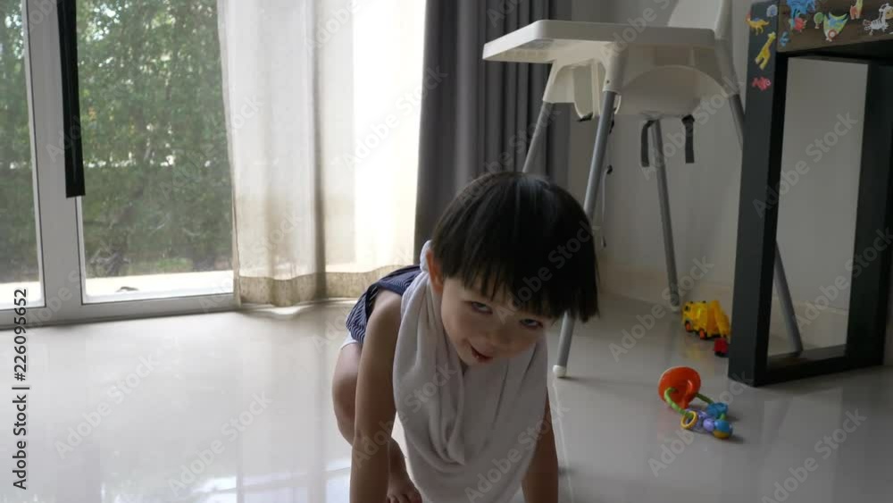 slow motion, cute child playful in home living room slow motion, cute child playful in home living room