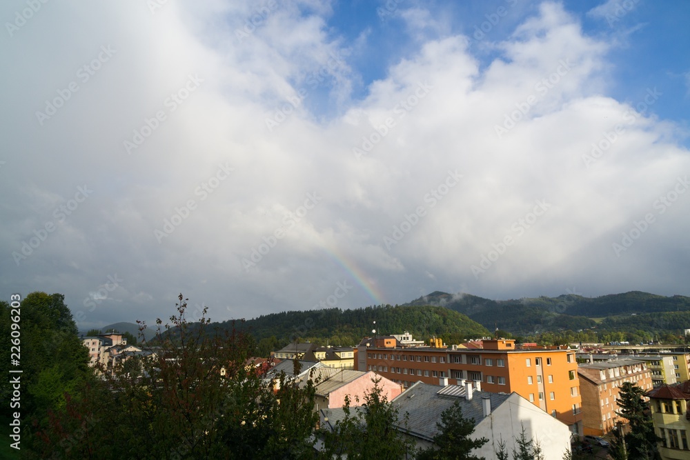 Obraz premium Rainbow over the town. Slovakia