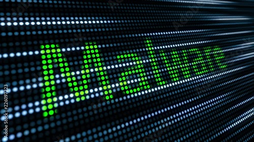 'Malware' being typed into an abstract tech background with moving cursor