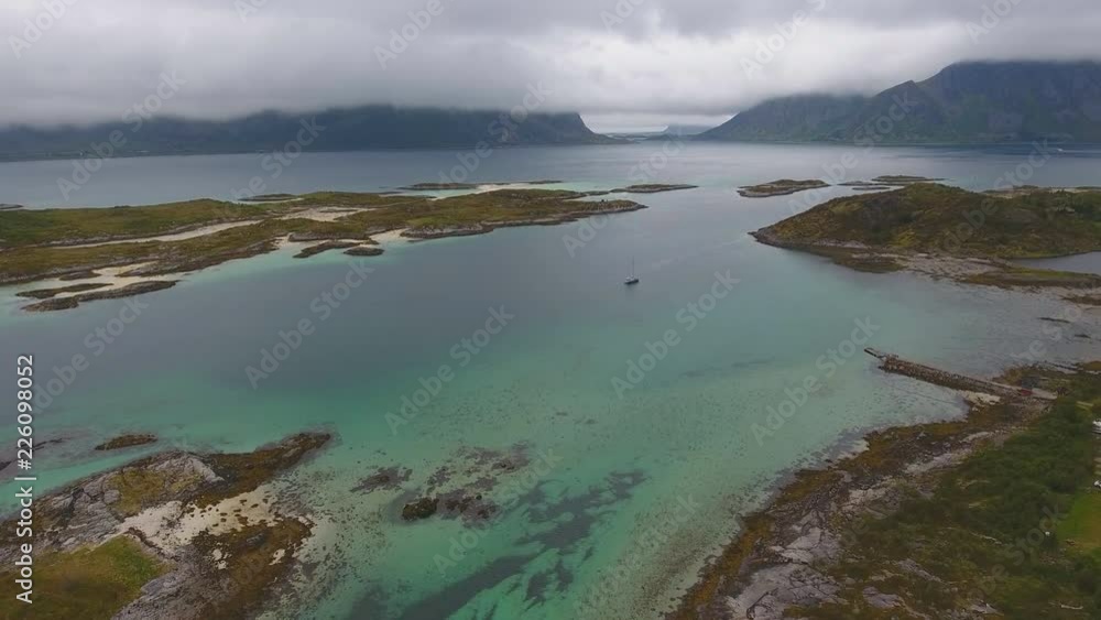 Aerial view of fjord shore and Islands in northern part of Norway in cloudy weather Aerial view of fjord shore and Islands in northern part of Norway in cloudy weather