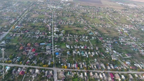 Top view of the village. One can see the roofs of the houses and gardens. Road and water in the village. Village bird's-eye view. photo