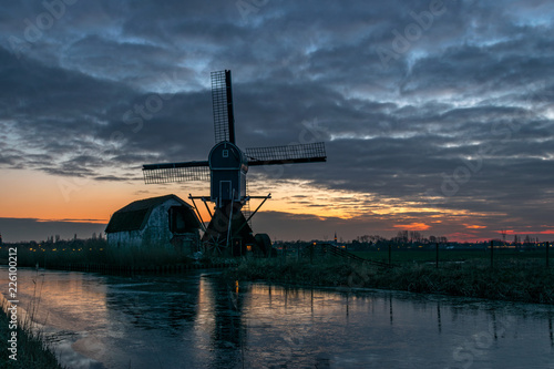 Windmill Along Frozen Canal