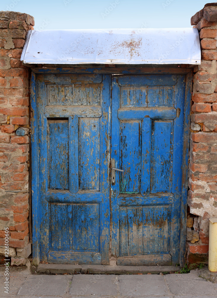 Old blue door on abandoned house Old blue door on abandoned house