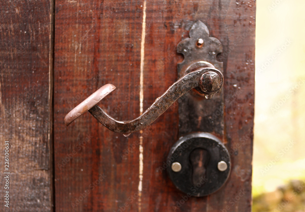 Ancient rusty door handle close-up detail Ancient rusty door handle close-up detail