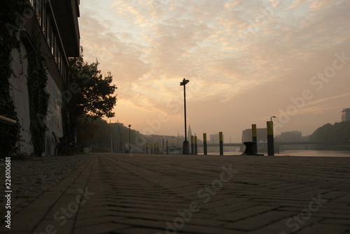 Sunrise in Bremen city in summer on the schlachte promenade bicycle way and beautifyl sky clouds photo