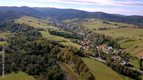 4k aerial: flight over village in Bieszczady mountains. 3840x2160, 30fps. photo