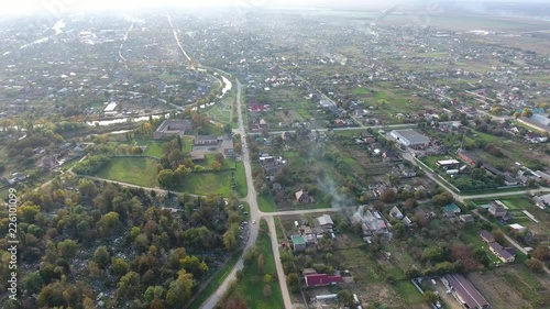 Top view of the village. One can see the roofs of the houses and gardens. Road and water in the village. Village bird's-eye view. photo