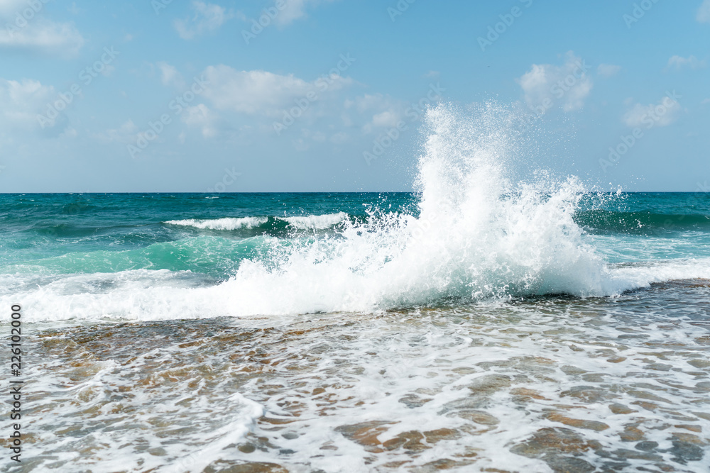 Fototapeta premium Waves on the beach on a bright sunny day