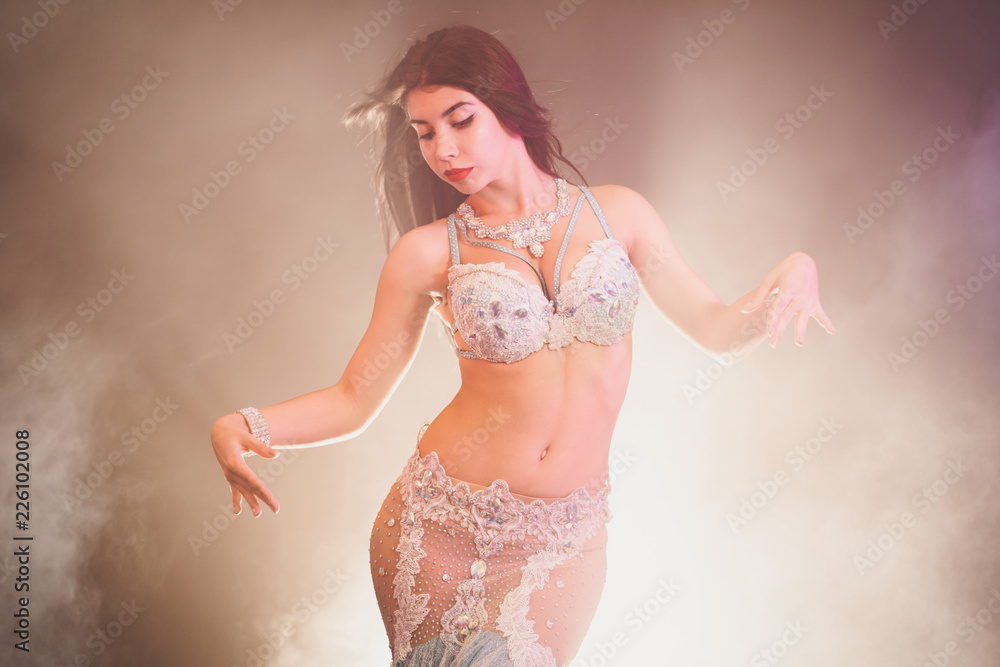 adorable sexy traditional oriental belly dancer girl dancing on