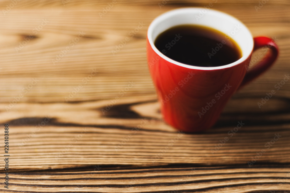 Full cup of black coffee on old wooden table with copy space. Morning concept Full cup of black coffee on old wooden table with copy space. Morning concept