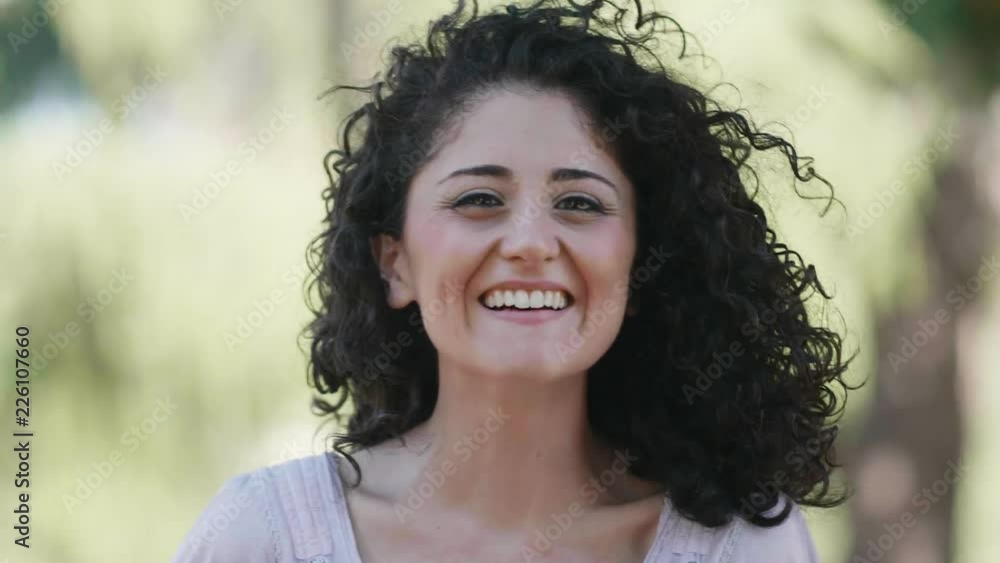 close up on Carefree beautiful young woman laughing at camera- outdoor close up on Carefree beautiful young woman laughing at camera- outdoor