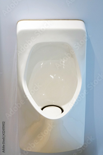 Close-up of toilet bowl. White toilet in the bathroom. Public toilet in the airport or restaurant, cafe.