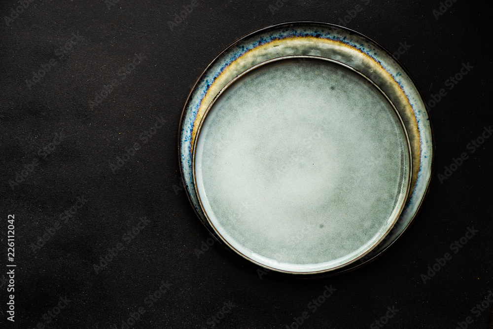 Ceramic plate on dark background Ceramic plate on dark background