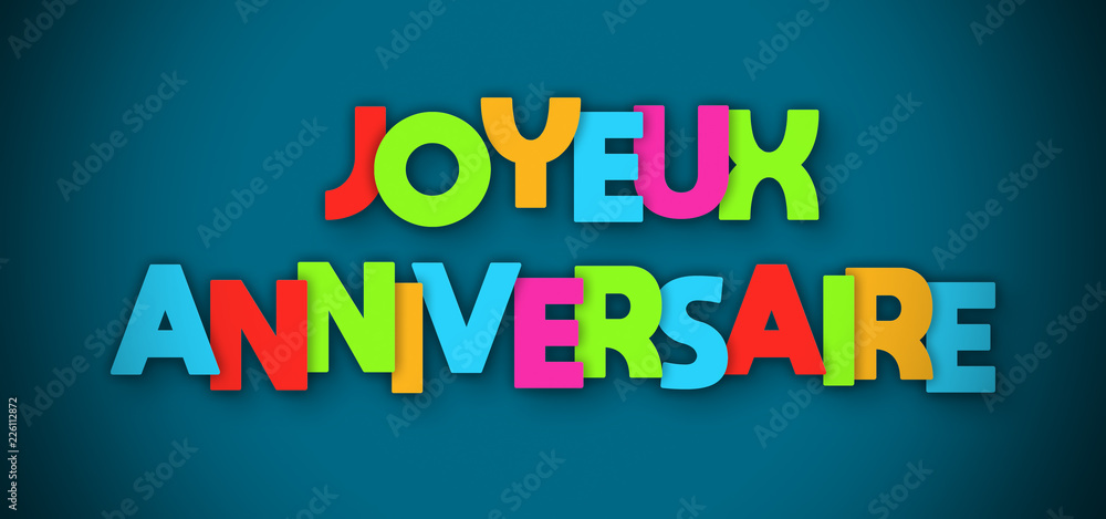 Joyeux Anniversaire - overlapping multicolor letters written on blue background