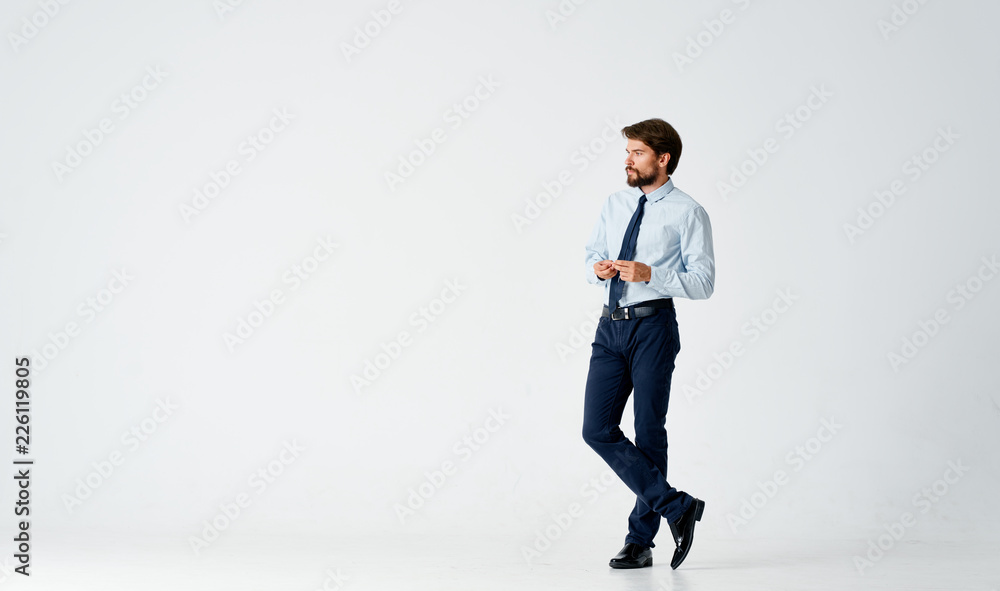 full-length business man looks at a free seat on a white isolated background full-length business man looks at a free seat on a white isolated background