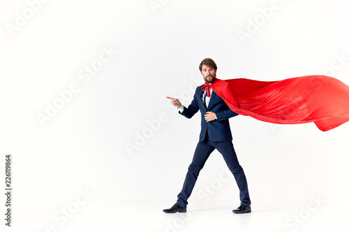 a hero in a red cloak shows free space on an isolated background