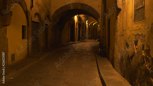 In focus background plate of empty Italian street at night to be composited