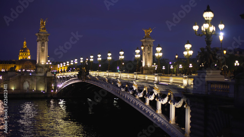 Sharp background plate of historic French bridge with light posts on at night © rocketclips