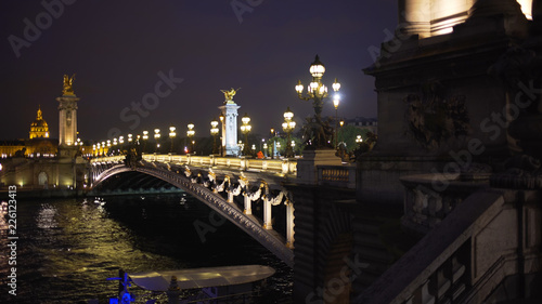 Romantic night scene of Alexandre III bridge across the Seine River in Paris