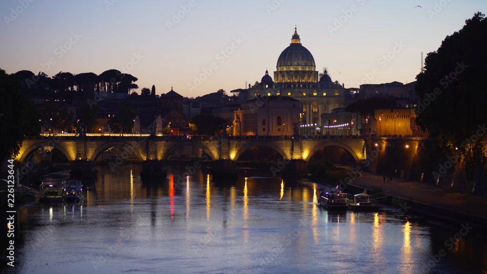 Clear twilight scene of Sant Angelo Bridge across Tiber River near Vatican City