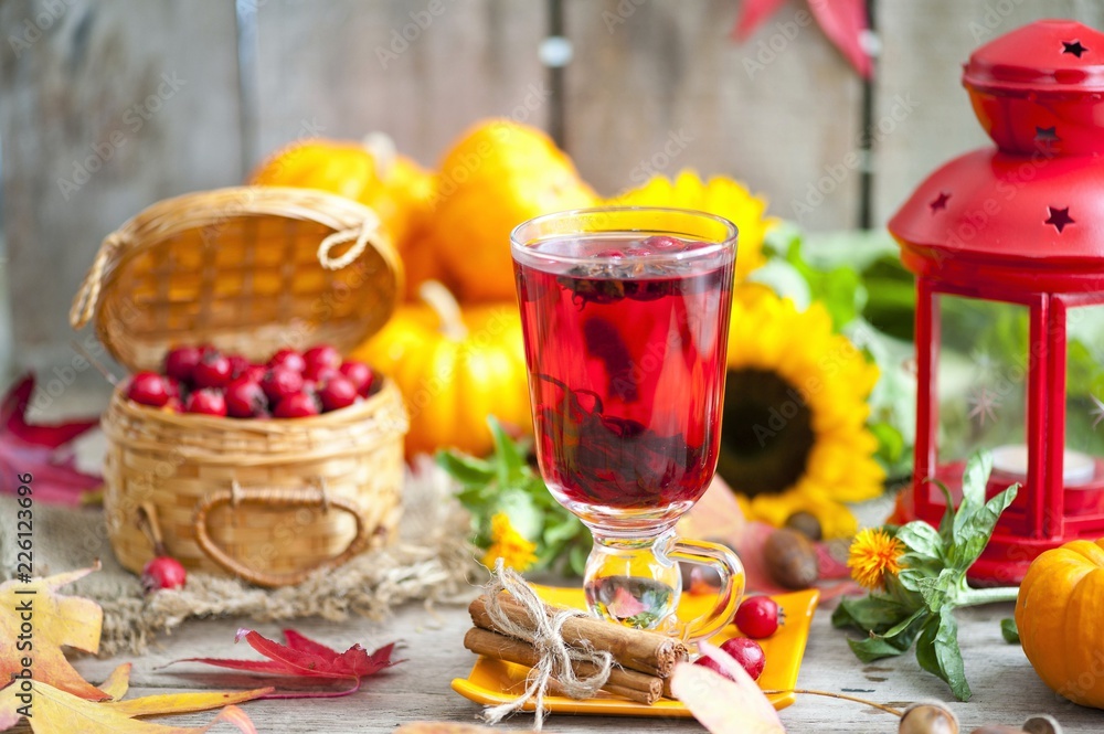 hot winter or autumn drink with spices and wild rose berries, mulled wine, hot wine