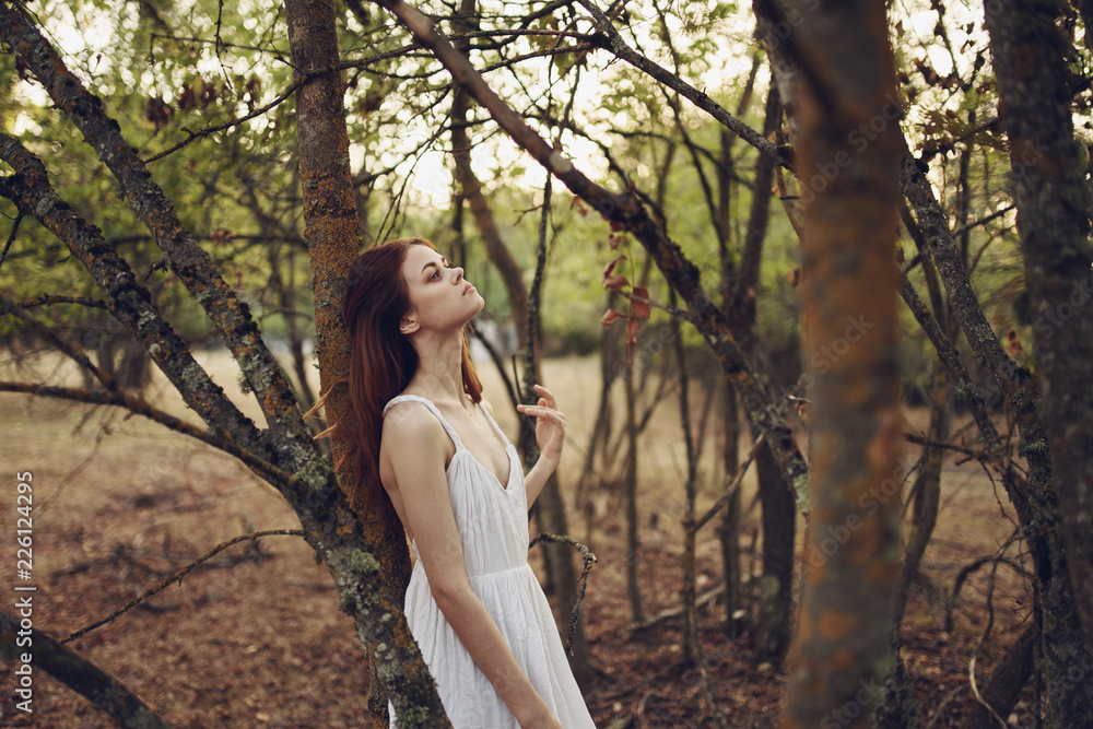 woman in the garden near the trees summer woman in the garden near the trees summer
