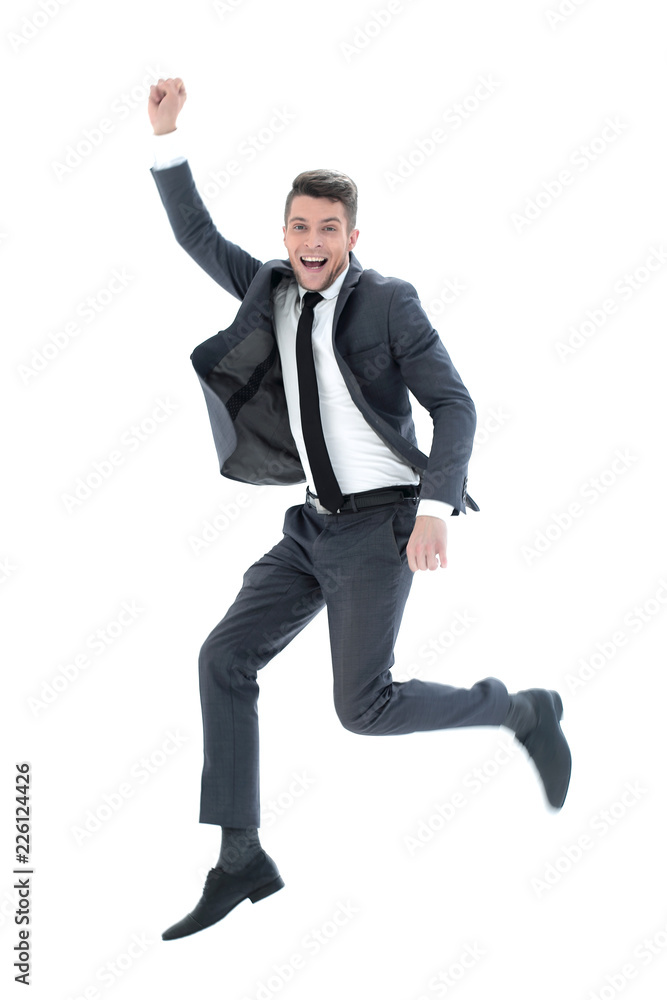 Full length portrait of an overjoyed businessman jumping
