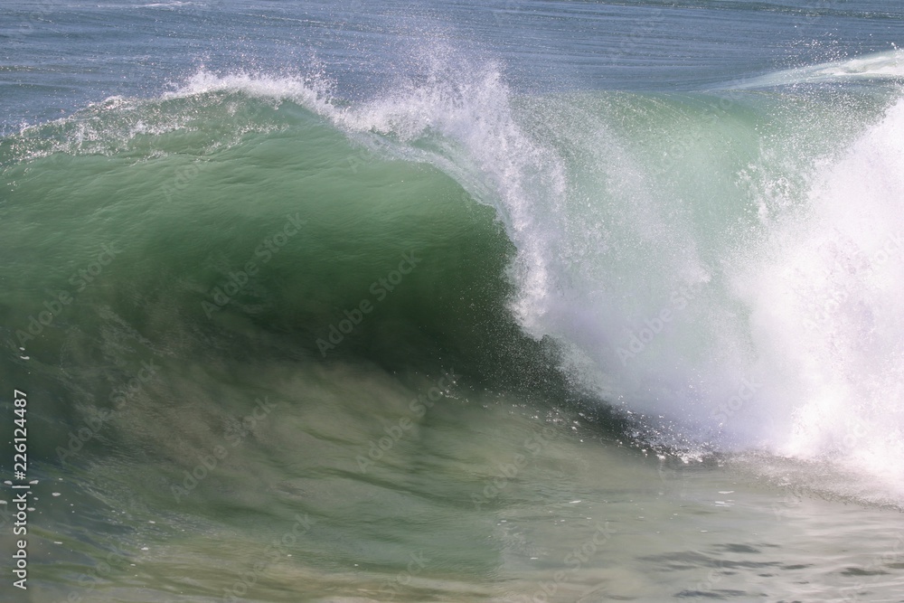 Large empty wave crashing in the ocean Large empty wave crashing in the ocean