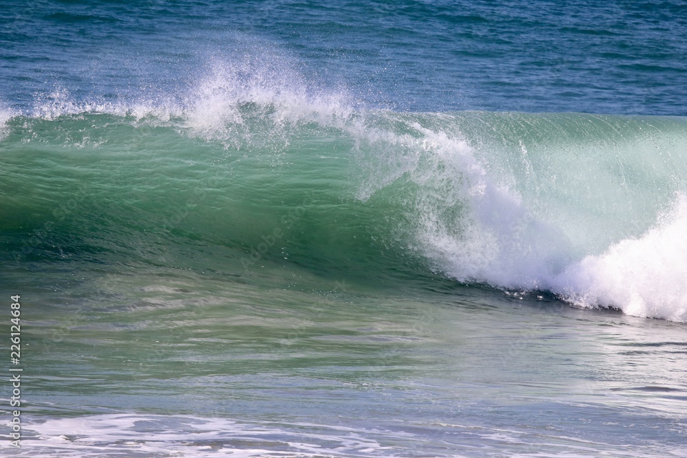 Large empty wave crashing in the ocean Large empty wave crashing in the ocean