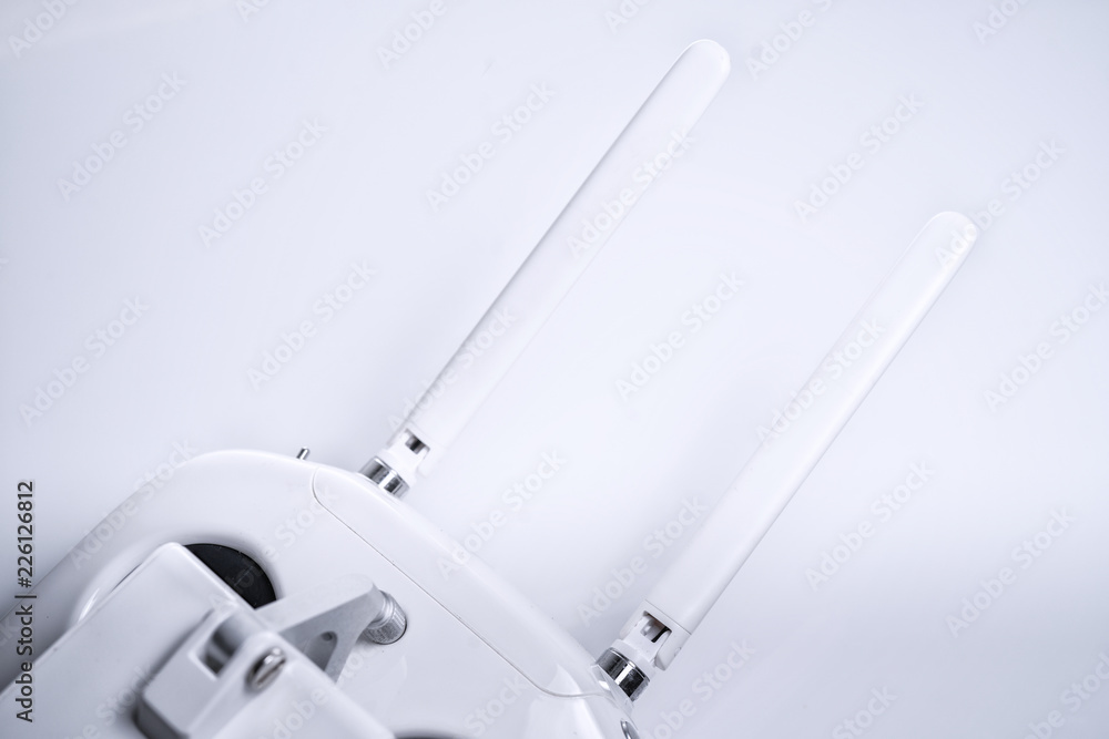 A white drone Remote Controller with antenna expand on white isolated background A white drone Remote Controller with antenna expand on white isolated background