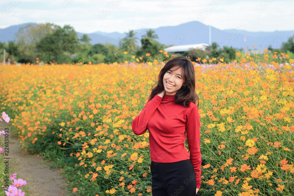 Girl travel in colorful cosmos flower field at Meaung Gan, Chiang Mai city, Thailand in Winter season Girl travel in colorful cosmos flower field at Meaung Gan, Chiang Mai city, Thailand in Winter season