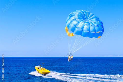 Blue parasail wing pulled by a boat. Sea summer recreation  - Cyprus. photo