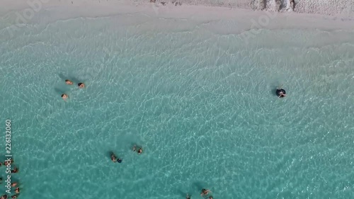 Aerial view of tourist in the sea. Crystal clear water on Fraser island, Lake Mckenzie, Queensland Australia photo