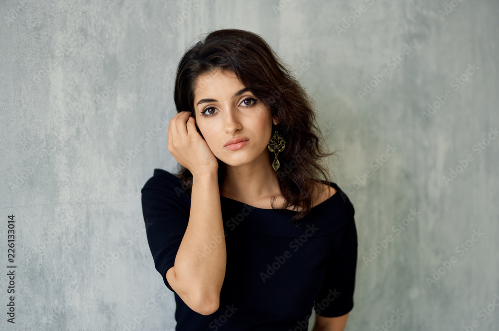 beautiful young woman on gray background beautiful young woman on gray background