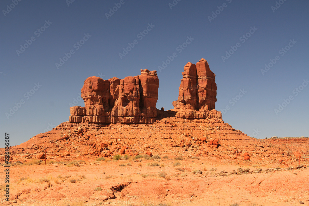 Red rock formation on the Navajo Indian Reservation near Shiprock in northern New Mexico with blue sky and rocky copy space. 